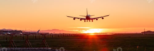 Preview: Commercial Airliner landing at Vancouver International Airport. Sunset