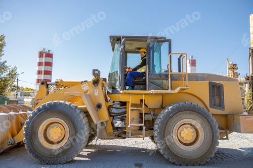 Preview: Cheerful man driving industrial truck at factory