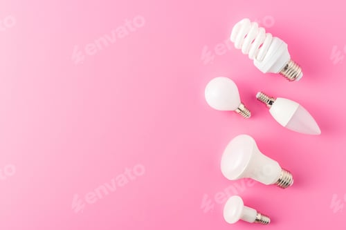 Preview: top view of various types of lamps on pink background