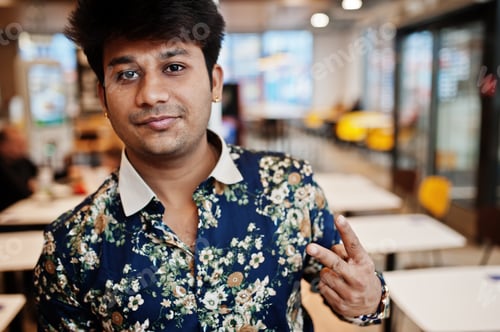 Preview: Indian man at fast food cafe