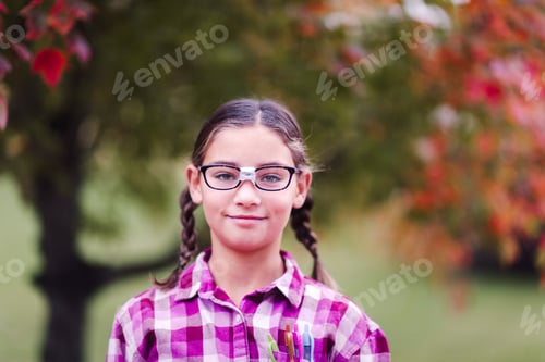 Preview: Girl with plaits and broken glasses dressed up as nerd