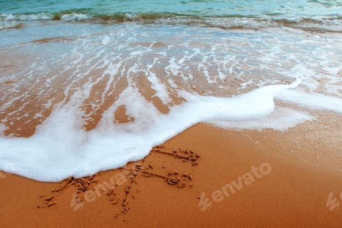 Preview: Figures in the sand on the beach
