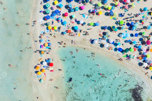 Preview: Top view from drone at beach and azure sea. Aerial view on beach, people and umbrellas.