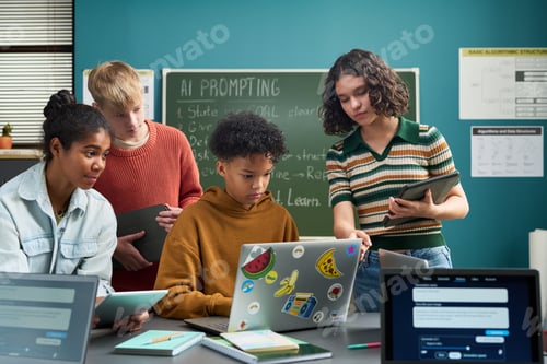 Preview: Diverse Teenagers Collaborating on Laptop during Classroom Technology Project