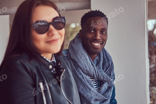 Preview: Portrait of an attractive stylish couple. African-American guy w