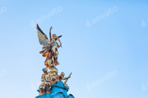 Preview: Golden Angel Sculpture In Sunset In London