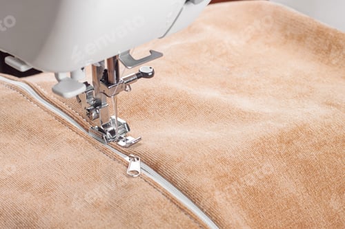 Preview: Modern Sewing Machine Special Presser Foot With Beige Fabric And Zipper, Closeup