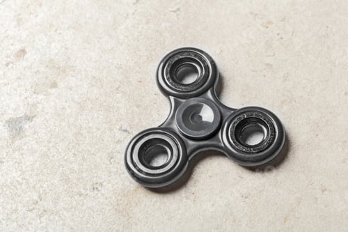Preview: fidget SPINNER stress relieving toy on stone background