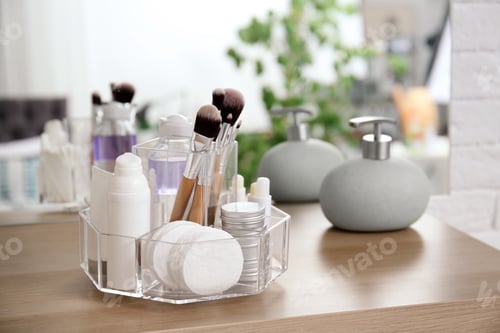 Preview: Organizer with cosmetic products on wooden table in bathroom