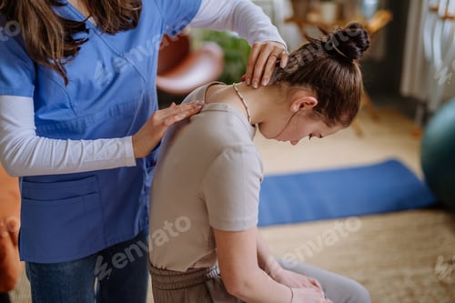 Preview: Teenage girl doing exercise with a nurse.