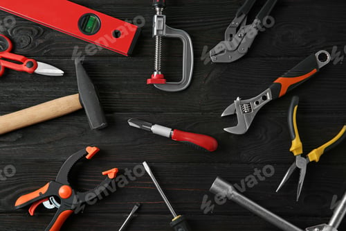 Preview: Set of repair tools on dark wooden background, flat lay