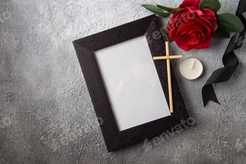 Preview: top view of picture frame with red flower on white surface photo death war soldier