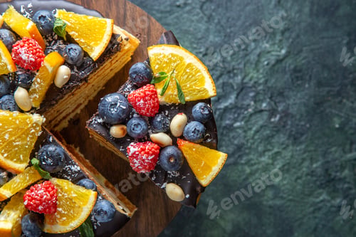 Preview: top view yummy chocolate cake with fruits on dark background biscuit dough dessert sugar cake pie