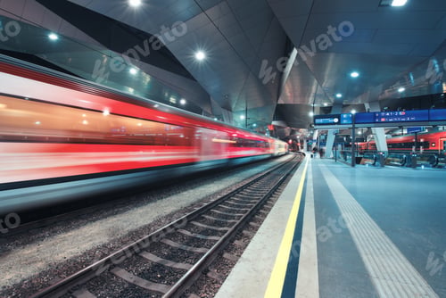 Preview: High speed train in motion on the railway station at night