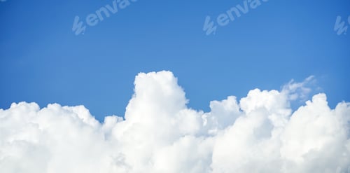 Preview: fluffy clouds or rainy clouds across blue sky.