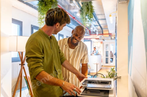 Preview: Diverse male coworkers enjoying teamwork and communication during office break
