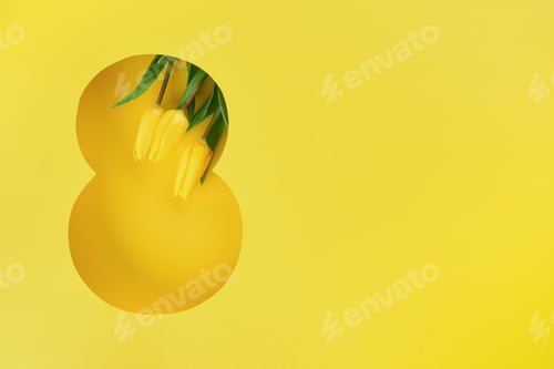 Preview: 8 March greeting card. Paper cut Eight made of yellow background and fresh spring flowers bouquet of