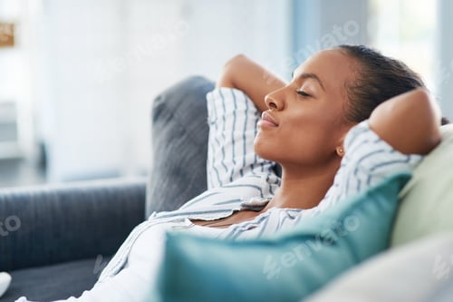 Preview: What a quiet and peaceful Sunday afternoon. Shot of a young woman sleeping on the sofa at home.