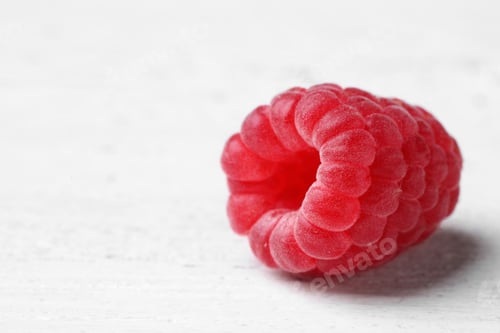 Preview: Delicious fresh ripe raspberry on white wooden table, closeup view. Space for text