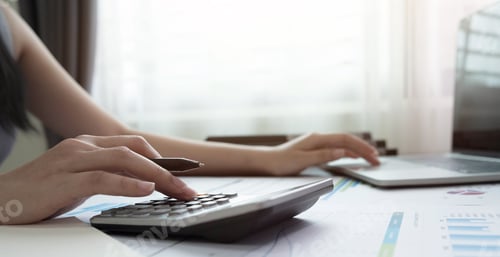 Preview: woman using calculator for calaulating finance, tax, accounting, statistics and analytic reserch