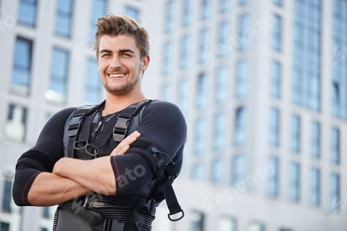 Preview: positive man attached to simulator while working out