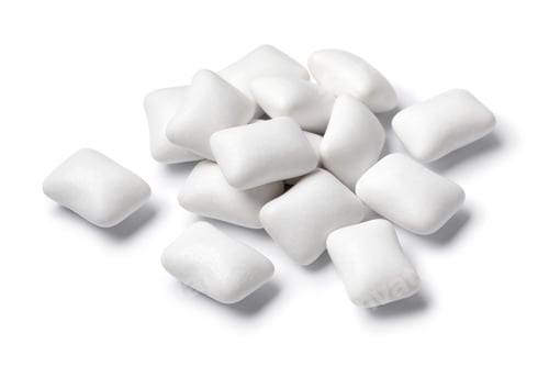 Preview: White chewing gum pieces close up on white background
