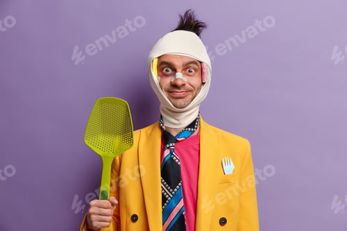 Preview: Rowdy man with glad expression, recovers after falling from fifth floor, wrapped in medical bandage,