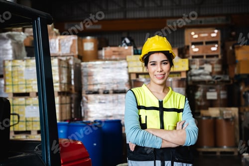 Preview: Portrait of a Happy warehouse worker in a warehouse or storehouse while looking at camera.