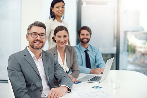 Preview: White collar confidence. Portrait of a group of businesspeople working together in a modern office.