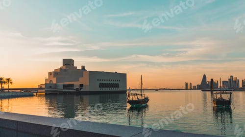 Preview: Museum of islamic art and two traditional dhows, Doha, Qatar during sunset