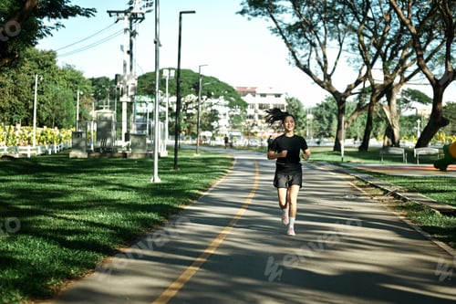 Preview: Sportswoman morning jogging at park urban city
