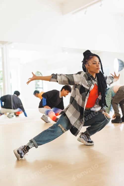 Preview: Vertical image of african american female hip hop dancer practicing at dance studio with copy space
