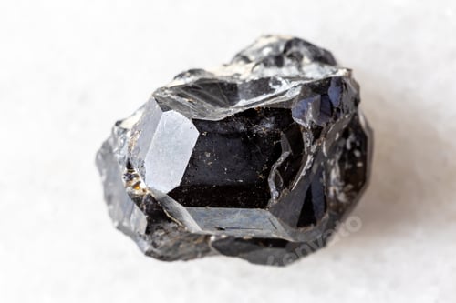 Preview: sample of rough black andradite garnet on white