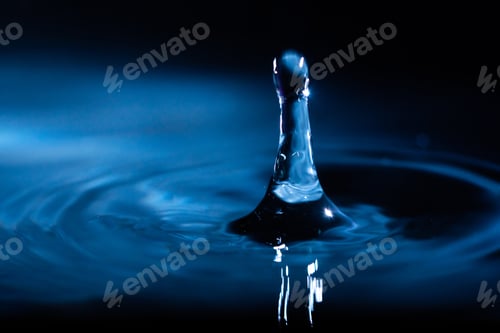 Preview: abstract background of blue water splash falling drop on liquid wave
