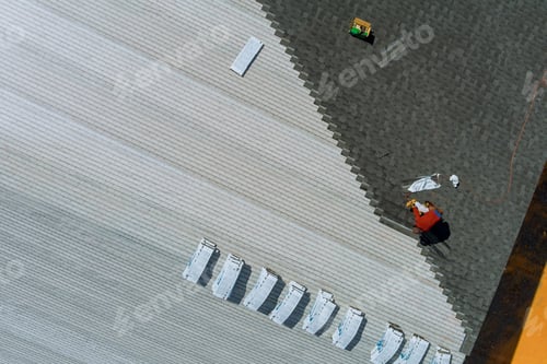 Preview: Roof installing asphalt shingles with new shingles of an building
