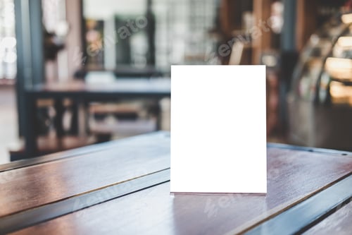 Preview: blank menu frame on table in coffee shop stand for your text of display your product