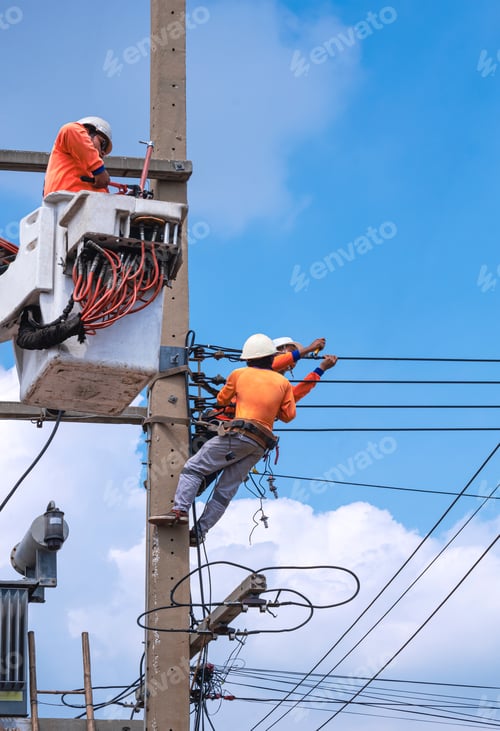 Preview: Electricians group with crane truck are working to install electrical systems on electric power pole