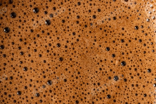 Preview: Brown coffee foam with bubles top view