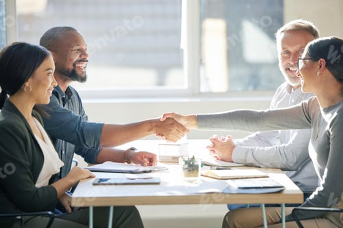 Preview: Cropped shot of two businesspeople shaking hands during a meeting in the boardroom