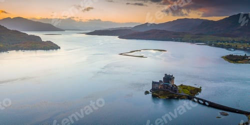 Preview: the island is surrounded by water, clouds, and mountains