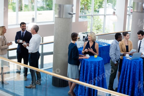 Preview: Business executives interacting with each other during break
