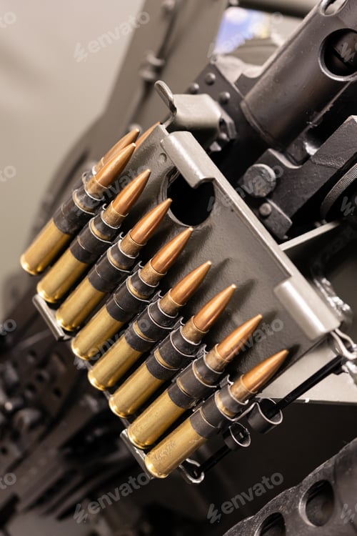 Preview: Close up of of bullets in a coaxial machine gun belt