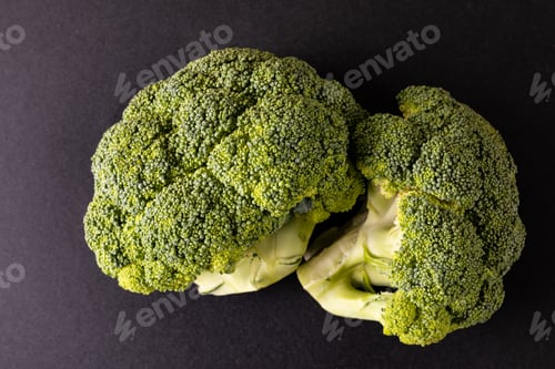 Preview: Overhead close-up of broccolis on black background