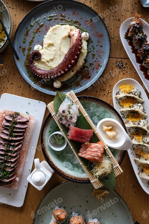 Preview: Japanese seafood fine dining meal spread on wooden table