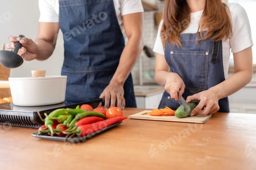 Preview: A man and a woman are cooking together in the kitchen.