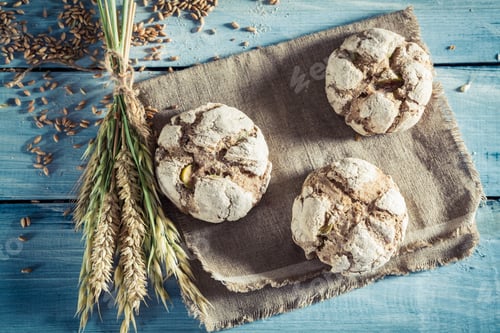 Preview: Delicious buns for breakfast on old wooden table