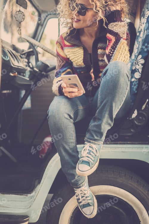 Preview: Smiling woman enjoying her road trip travel lifestyle