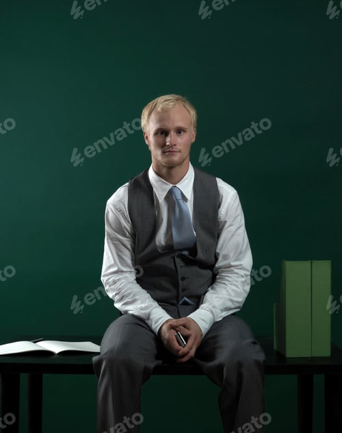 Preview: Business man sitting at desk