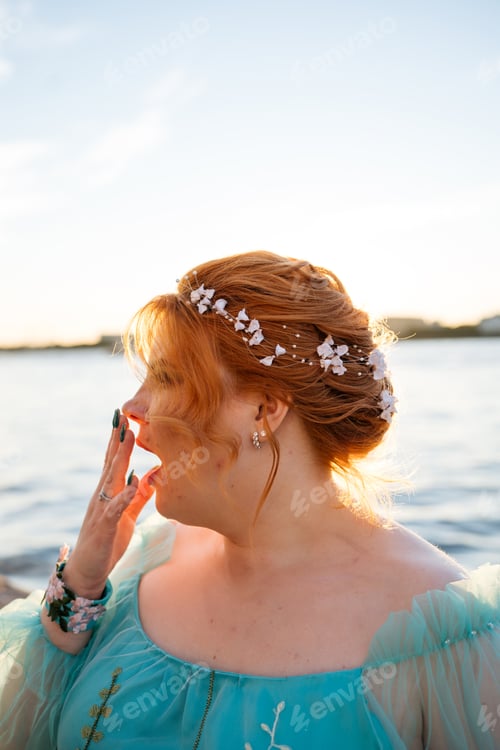 Preview: Portrait of young yawning woman with wedding hairstyle.