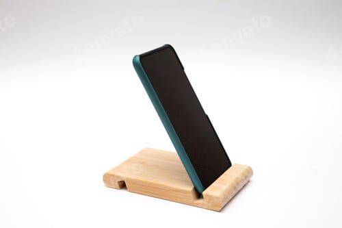 Preview: Wooden smartphone stand with smartphone on white background
